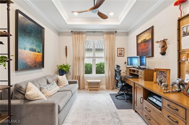 office area featuring ceiling fan, crown molding, and a tray ceiling