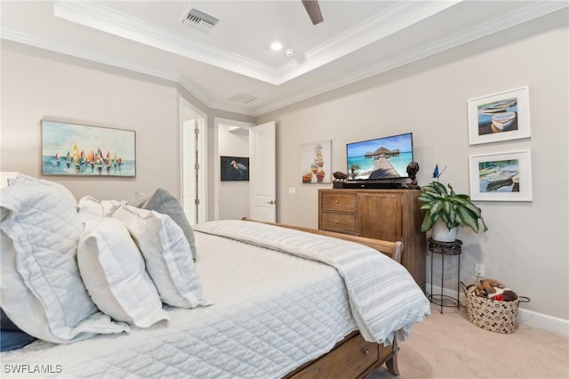 bedroom featuring ceiling fan, ornamental molding, light colored carpet, and a raised ceiling