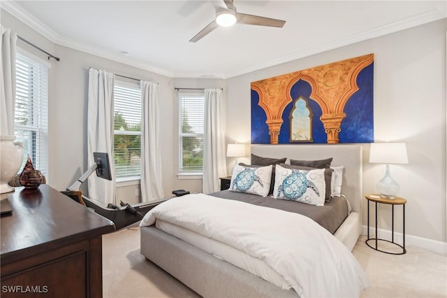 bedroom featuring ceiling fan, crown molding, and light colored carpet