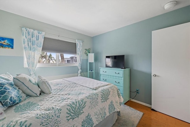 bedroom featuring light wood-type flooring