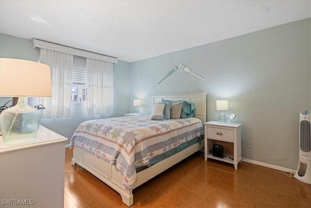 bedroom featuring hardwood / wood-style flooring