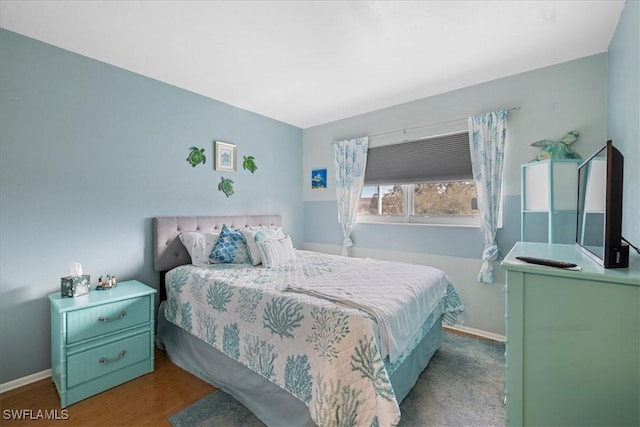 bedroom featuring wood-type flooring