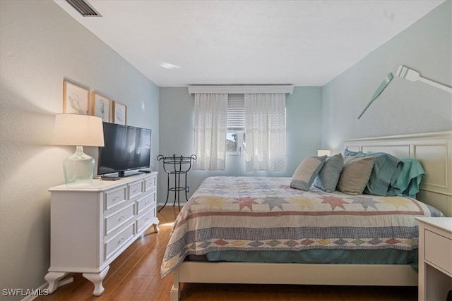 bedroom with wood-type flooring