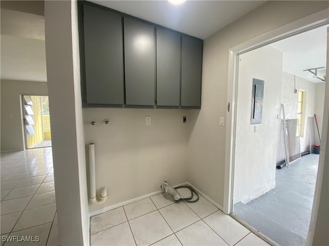 laundry room featuring light tile patterned floors, electric panel, cabinets, and hookup for an electric dryer