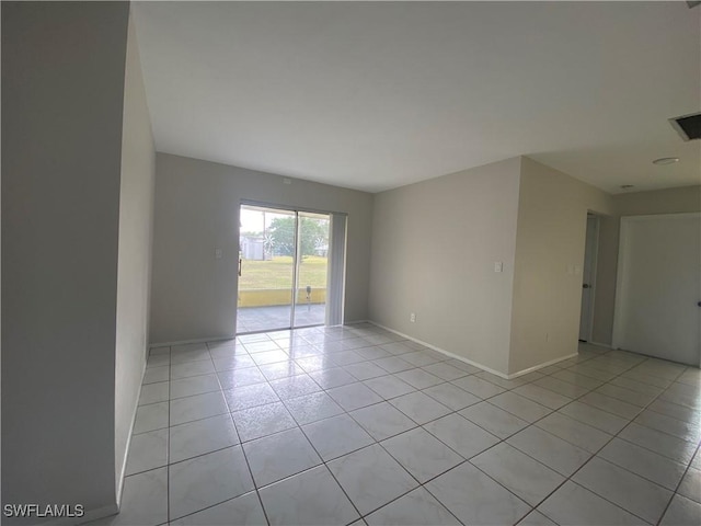 spare room with light tile patterned floors