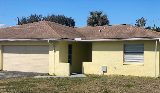 view of property exterior with a garage and a lawn