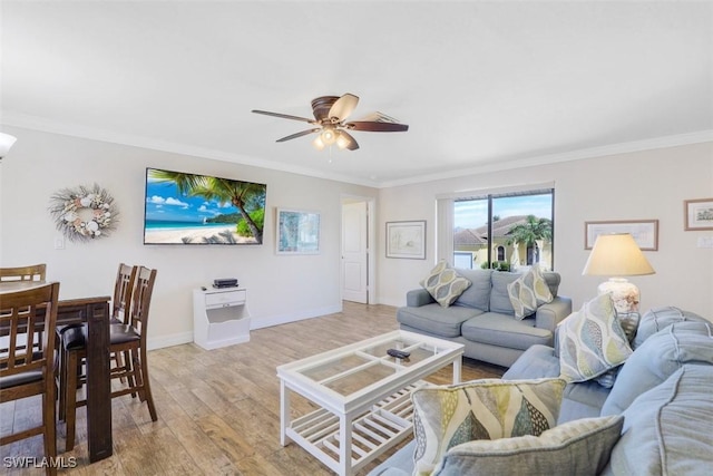 living room featuring light wood-type flooring, ceiling fan, and ornamental molding