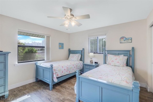 bedroom with ceiling fan and wood-type flooring