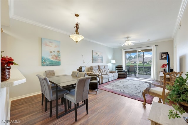 dining room featuring ceiling fan, ornamental molding, and dark hardwood / wood-style floors