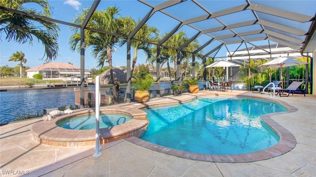 view of pool featuring an in ground hot tub, a lanai, a water view, and a patio