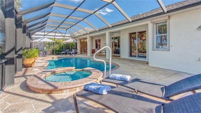 view of pool with a patio, glass enclosure, and an in ground hot tub