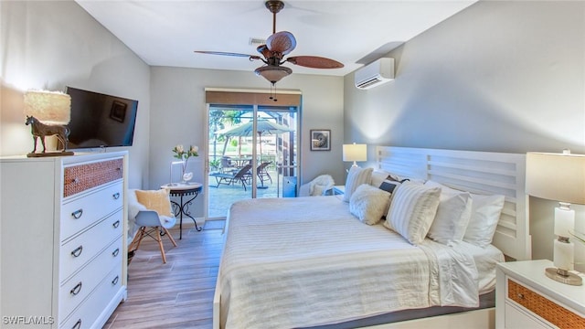 bedroom featuring ceiling fan, light hardwood / wood-style flooring, access to outside, and a wall mounted AC