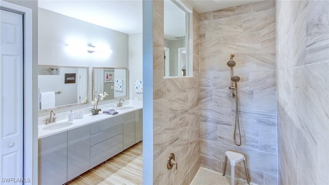 bathroom featuring vanity and a tile shower