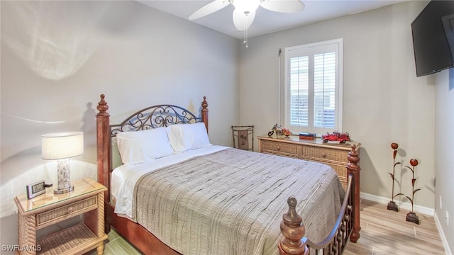 bedroom featuring ceiling fan and light hardwood / wood-style flooring