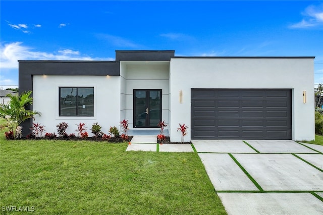 contemporary house featuring driveway, french doors, an attached garage, and stucco siding