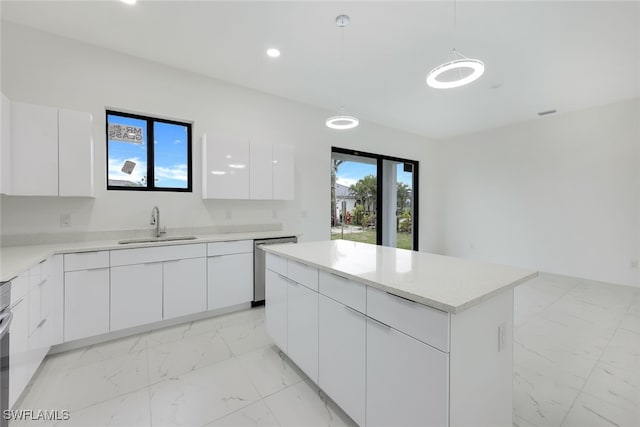 kitchen featuring a center island, marble finish floor, white cabinets, a sink, and modern cabinets