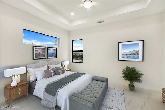 bedroom featuring recessed lighting, visible vents, baseboards, marble finish floor, and a raised ceiling