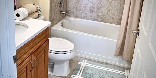 full bathroom featuring toilet, vanity, and shower / tub combo with curtain