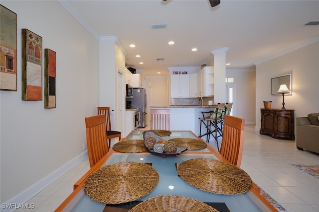 tiled dining space with crown molding