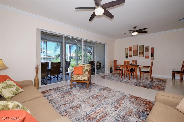 living room with ceiling fan, crown molding, and tile patterned flooring