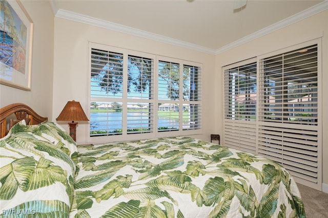 carpeted bedroom with ornamental molding