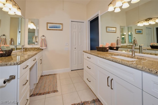 bathroom featuring tile patterned flooring and vanity