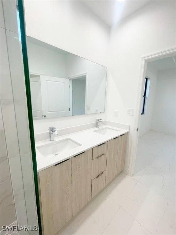 bathroom with double vanity and a sink