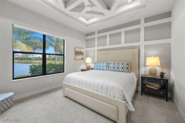 bedroom with carpet, a water view, ceiling fan, beam ceiling, and coffered ceiling