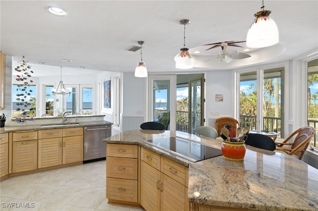 kitchen featuring pendant lighting, dishwasher, light brown cabinets, black electric stovetop, and sink