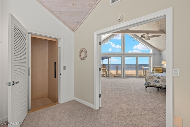 corridor with a water view, vaulted ceiling, wood ceiling, and carpet floors