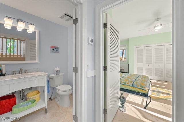 bathroom featuring ceiling fan, vanity, tile patterned floors, and toilet