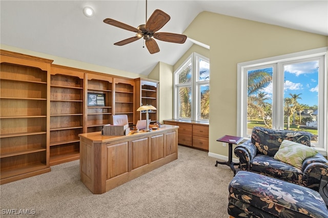 office space featuring ceiling fan, light colored carpet, and vaulted ceiling