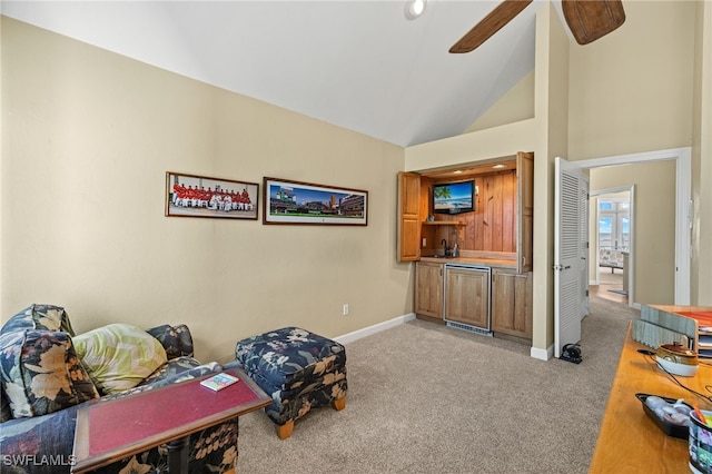 living area featuring light carpet, ceiling fan, and lofted ceiling