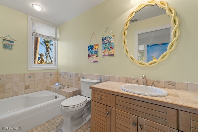 bathroom with toilet, a bathtub, tile patterned floors, and vanity