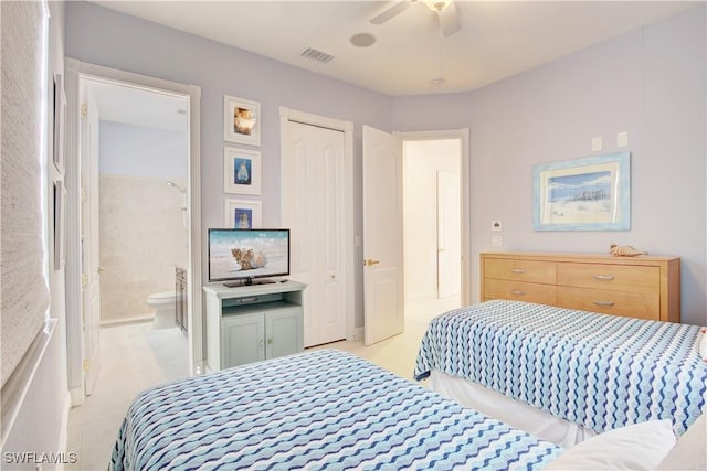 bedroom with light tile patterned floors, ceiling fan, visible vents, and connected bathroom