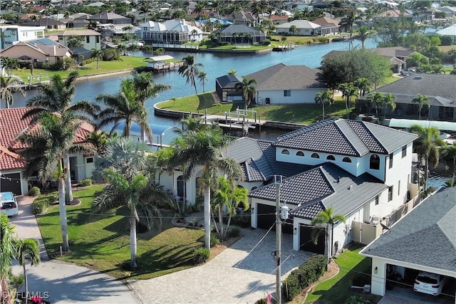 aerial view featuring a water view and a residential view