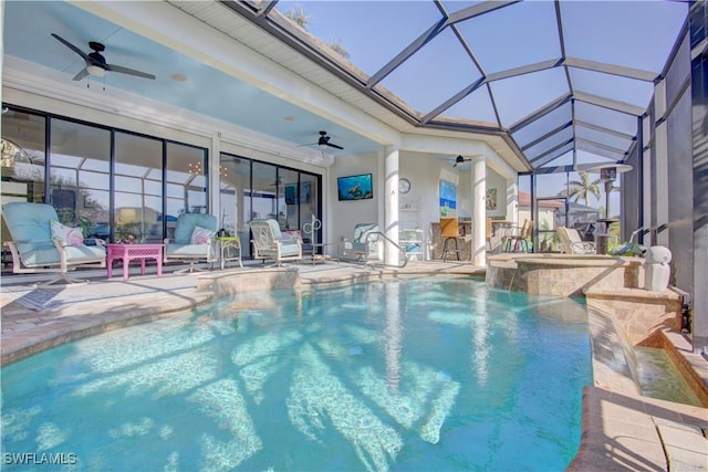 outdoor pool featuring outdoor dry bar, glass enclosure, ceiling fan, and a patio area