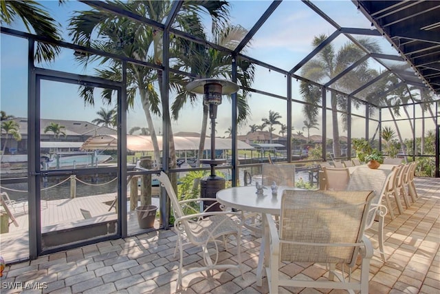 view of patio / terrace with a boat dock and a lanai