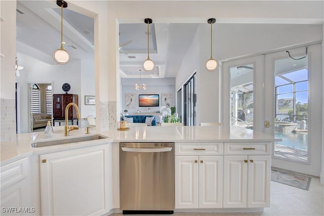 kitchen with a sink, white cabinets, light countertops, backsplash, and dishwasher