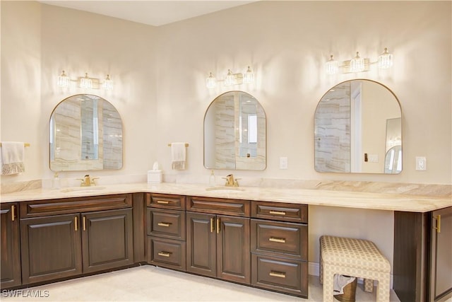 full bath featuring a sink and double vanity