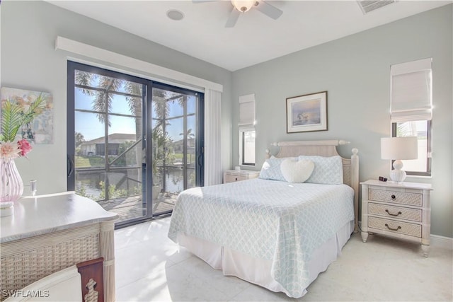 bedroom featuring ceiling fan, access to outside, multiple windows, and visible vents