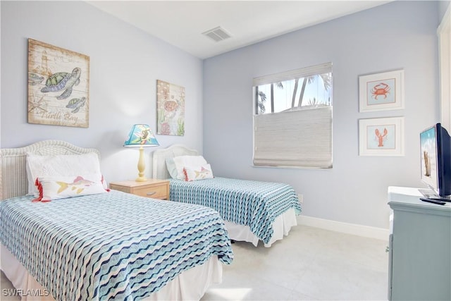 bedroom with visible vents and baseboards