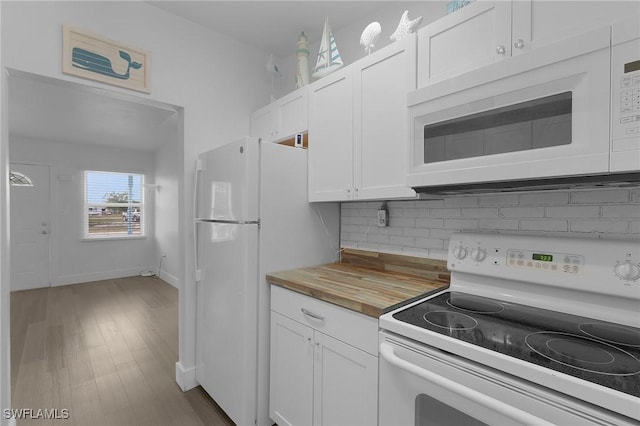 kitchen featuring wooden counters, decorative backsplash, white cabinetry, wood finished floors, and white appliances