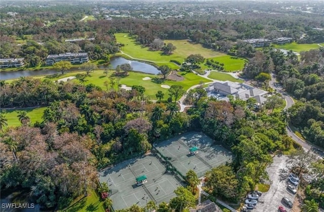 bird's eye view featuring a water view and view of golf course