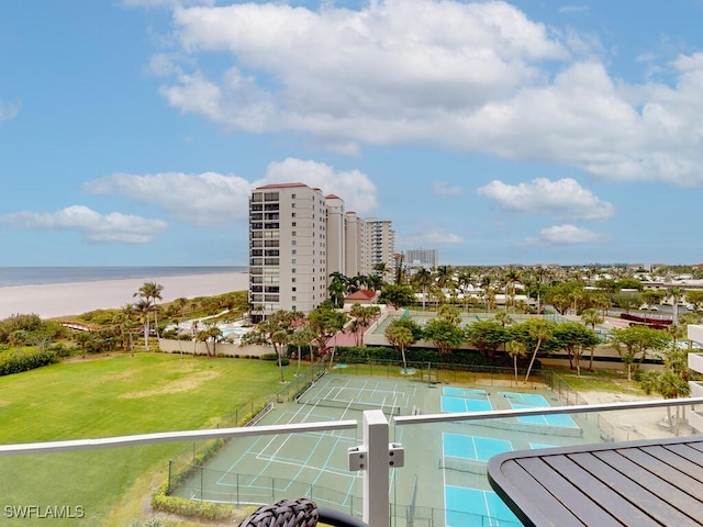 view of pool featuring a lawn and a water view