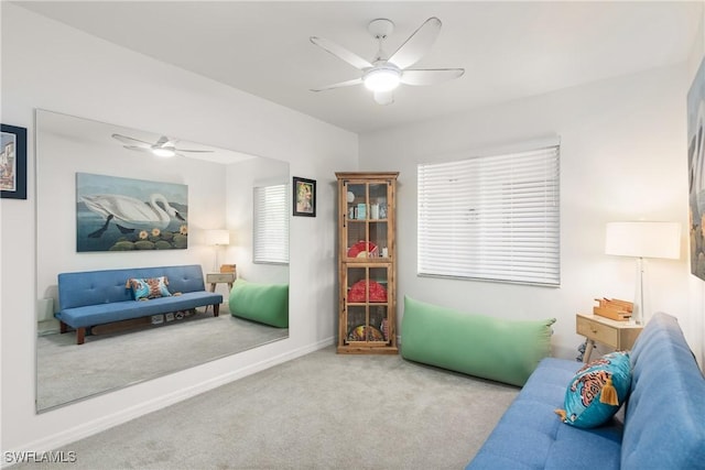 living room featuring light carpet and ceiling fan