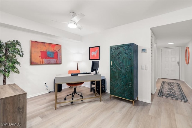 home office featuring ceiling fan and light wood-type flooring