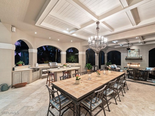 view of patio / terrace featuring area for grilling, sink, and ceiling fan