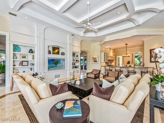 living room featuring crown molding, ceiling fan with notable chandelier, beam ceiling, and built in shelves