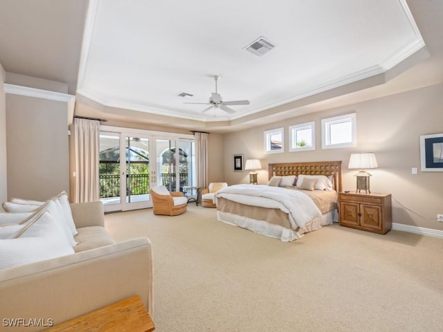 carpeted bedroom with access to exterior, crown molding, a raised ceiling, and ceiling fan